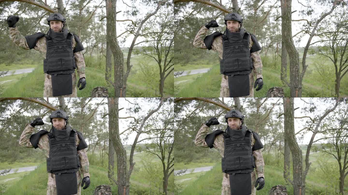 一名乌克兰士兵身穿迷彩服，头戴头盔，向前方望去。军人享受自然