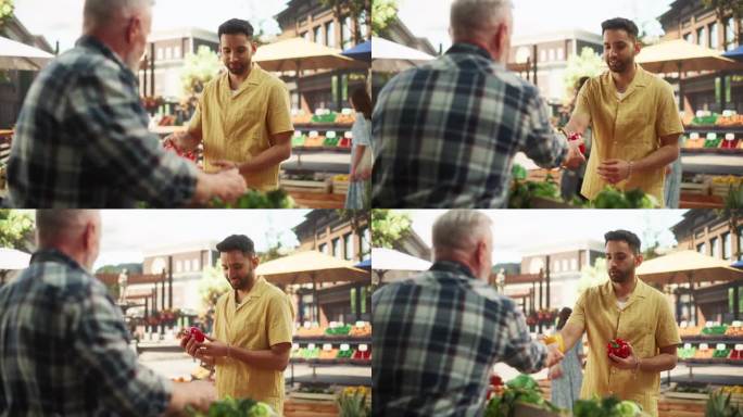 一位年轻英俊的顾客为健康早餐购买有机应季水果和蔬菜的画像。多民族男子从当地街头小贩那里购买可持续的生