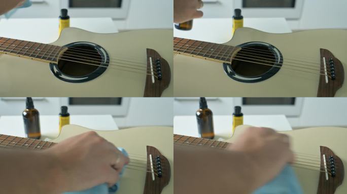 男子清洗白色原声吉他的弦。吉他服务理念。4k视频片段