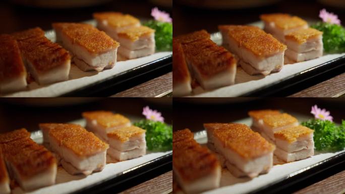 用中国香脆猪肉体验奢华的缩影。酥脆的皮和嫩滑的肉完美平衡，这道美味佳肴是烹饪的杰作