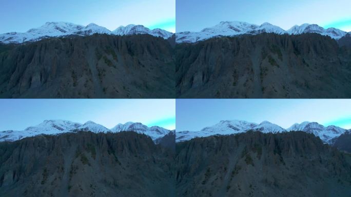 空中近距离拍摄喜马拉雅山脉，雪峰和山后的太阳。雄伟壮丽的尼泊尔喜马拉雅山脉背景。
