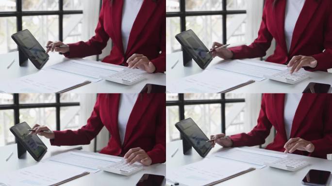 一个女人在现代办公室里用平板电脑工作的画像。制作账目分析报告。房地产投资信息财税系统概念