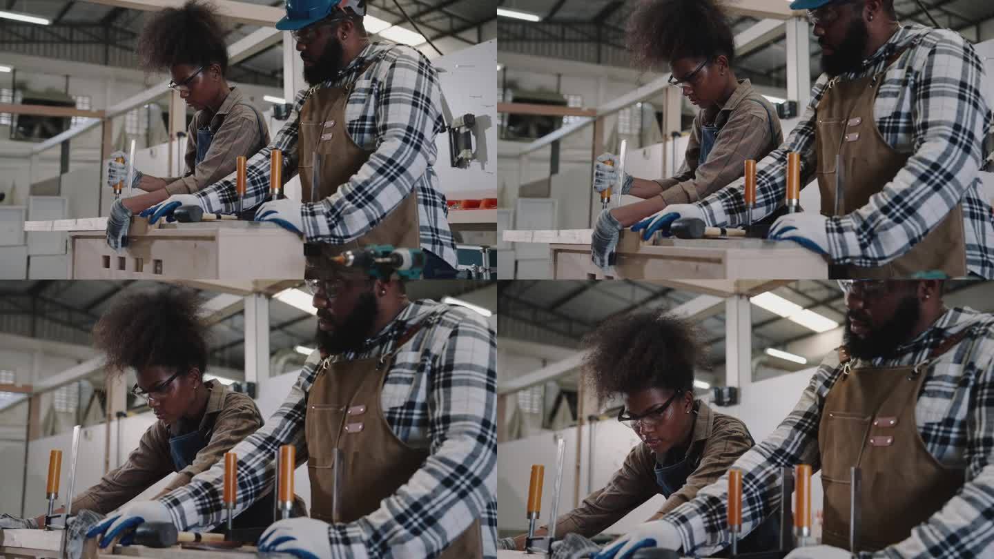 两名非裔美国木匠在家具木材班学习，在车间当木匠。