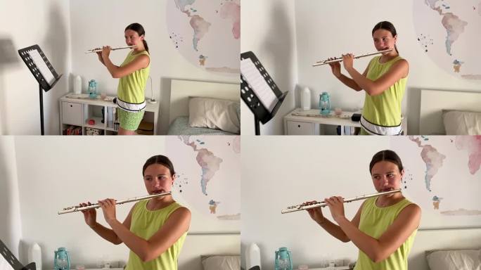 一个十几岁的女孩在她的房间里吹笛子
