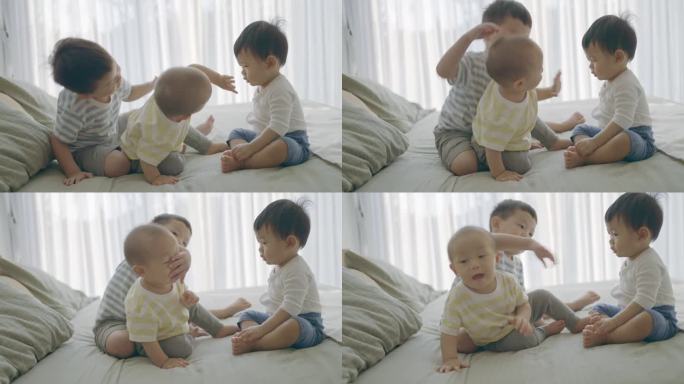 兄弟姐妹的宁静静修:亚洲男孩和小弟弟在家里放松和享受家庭时光