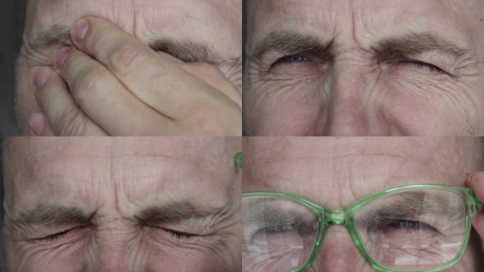 一个戴眼镜的男人眨着眼睛的特写镜头。
