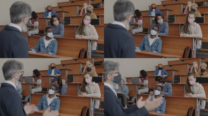 大流行期间，一群戴着口罩的学生在课堂上专心听讲