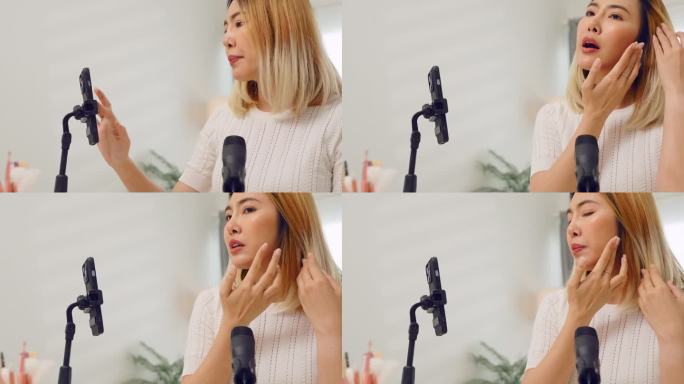 亚洲女博主录制化妆教程视频，在家为网站或社交媒体上的订阅者涂抹护肤面霜
