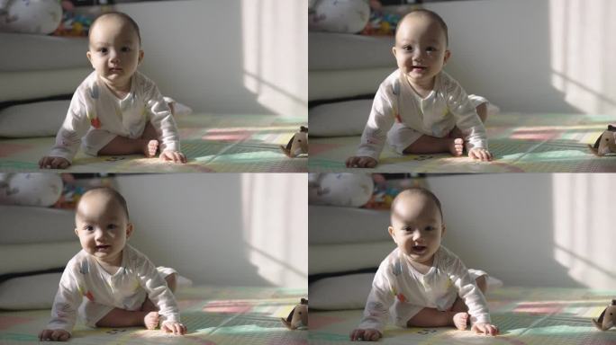 7个月大的婴儿望着镜头微笑的肖像