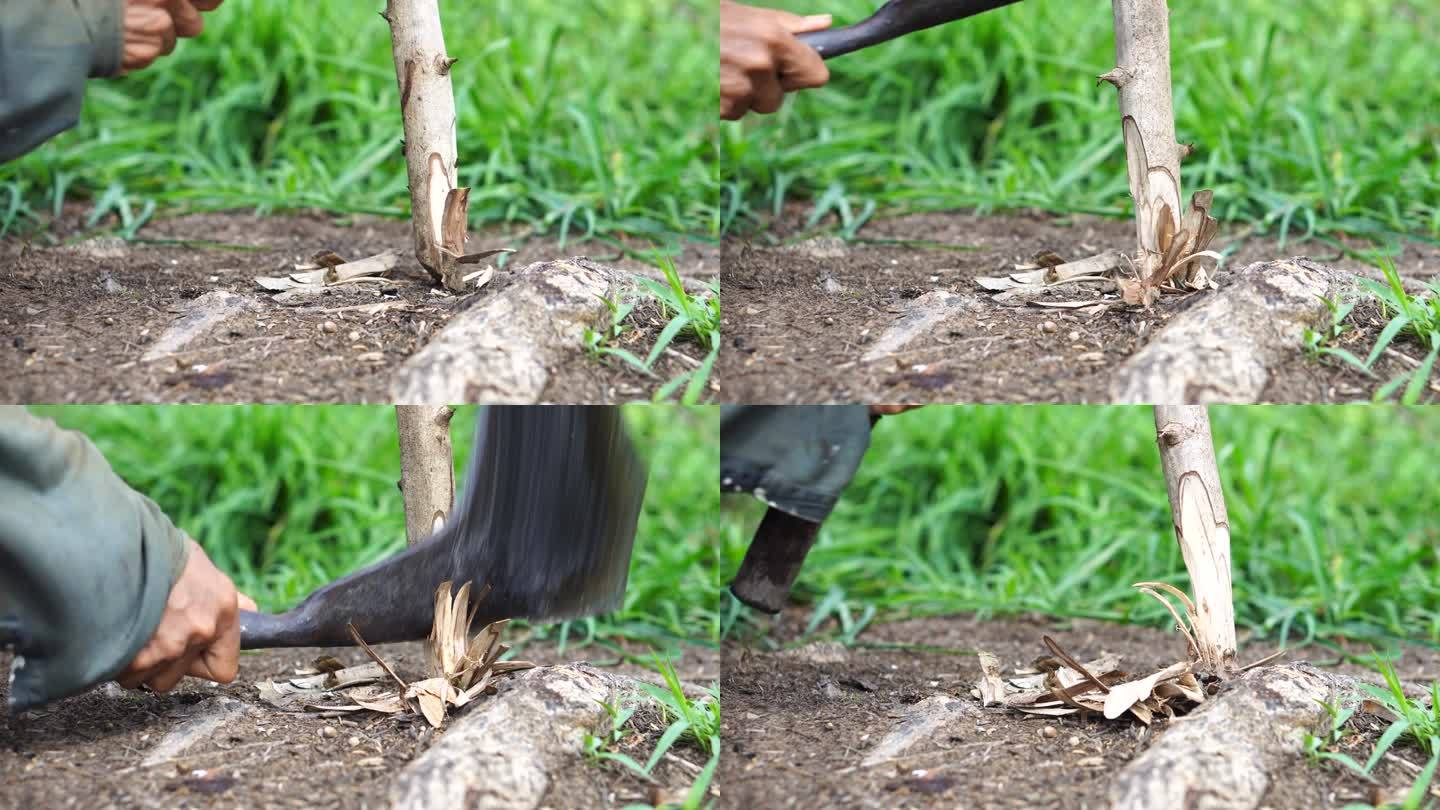 一个农民用刀磨木头。