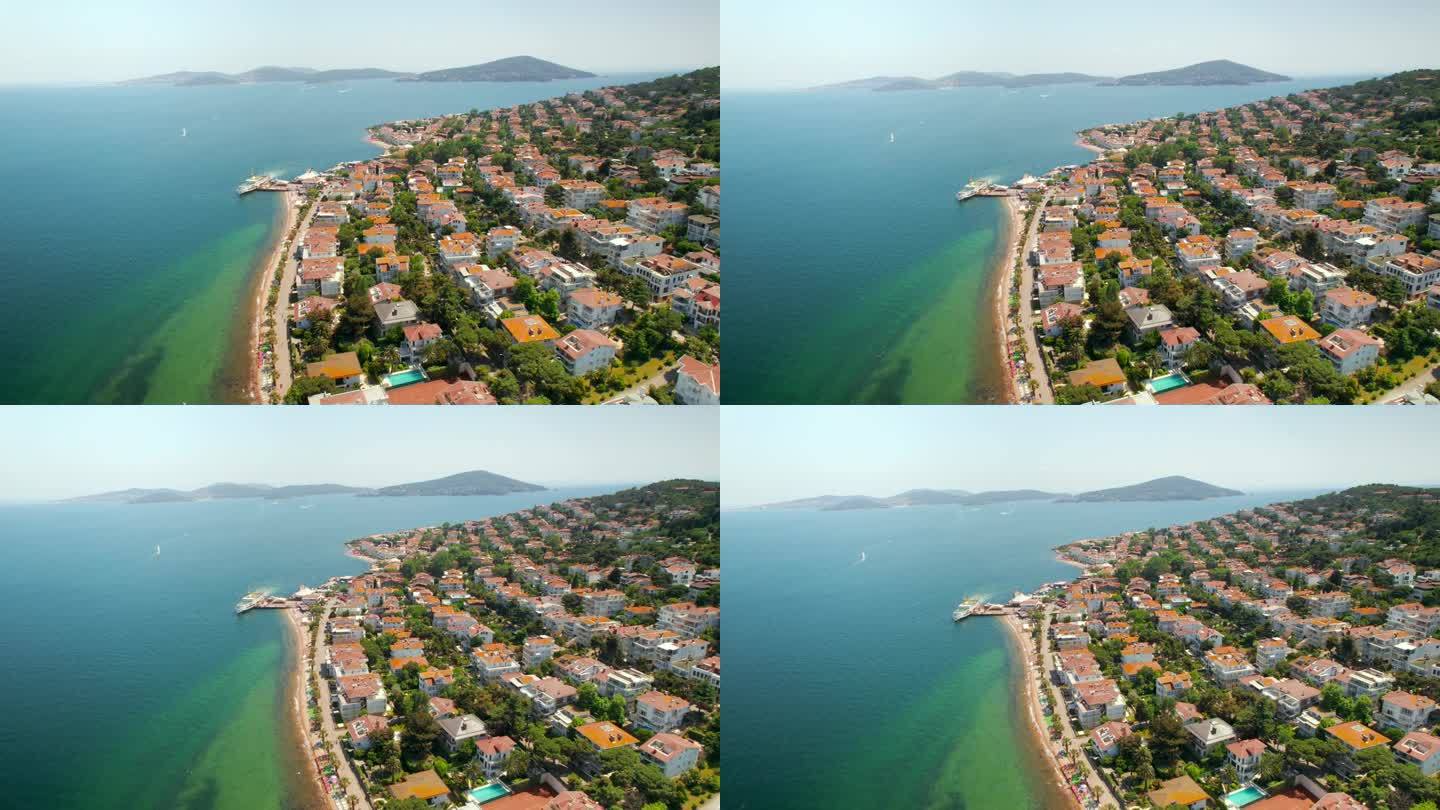 土耳其Kinaliada的空中无人机视图。多个住宅建筑位于马尔马拉海岸，背景是其他王子群岛