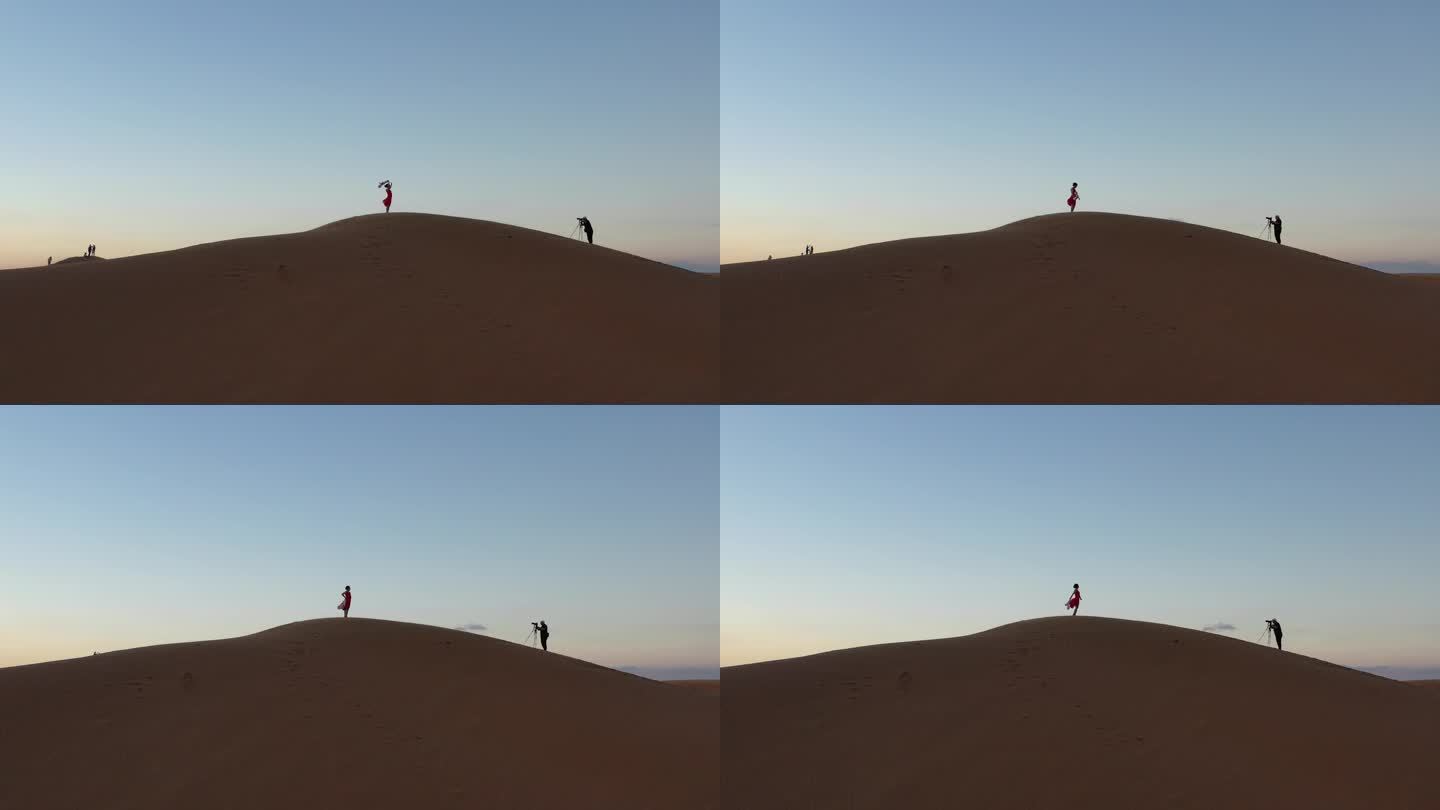 4K原素材-航拍腾格里沙漠中拍照的女孩