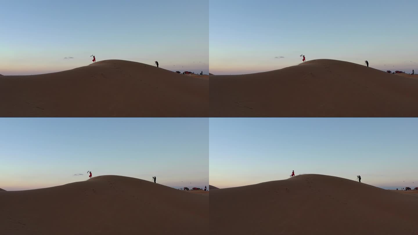4K原素材-航拍腾格里沙漠中拍照的女孩