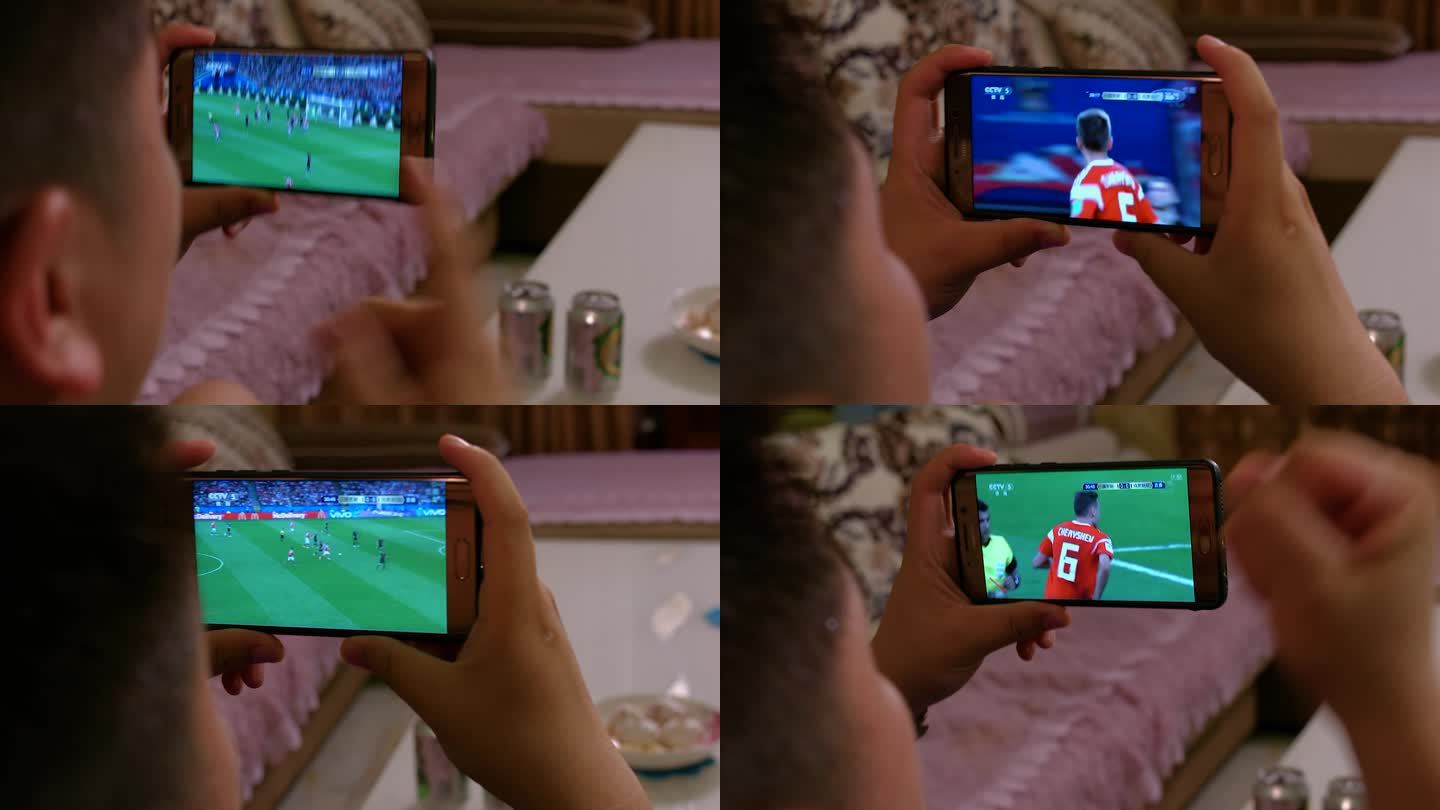 男人看足球比赛手机观看