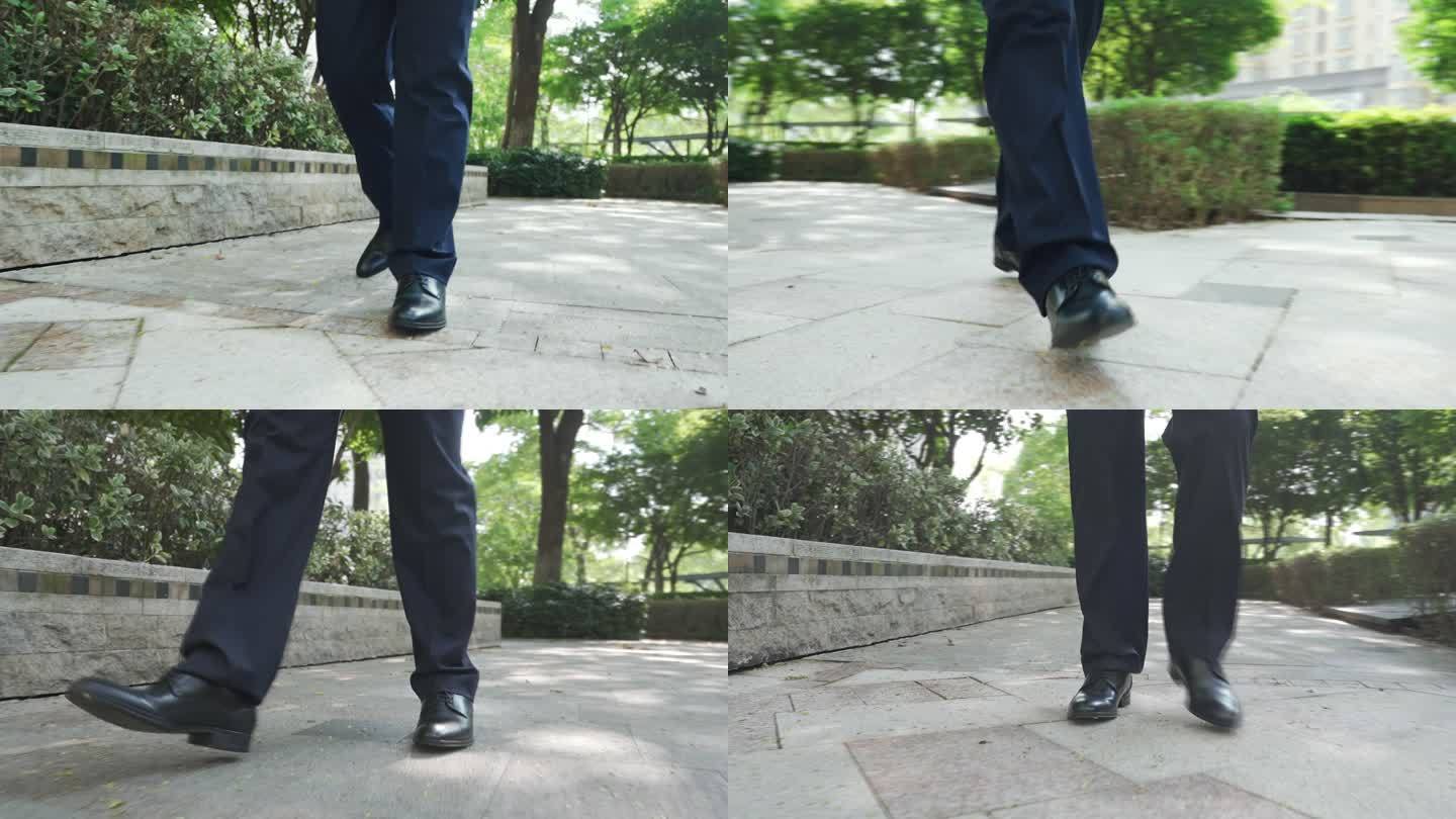黑色皮鞋行走脚步特写低角度