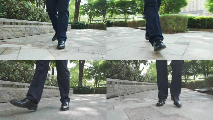 黑色皮鞋行走脚步特写低角度