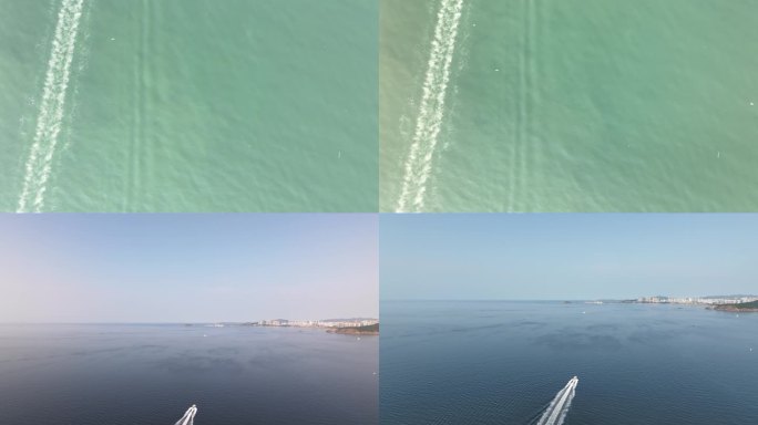 航拍俯瞰威海双岛湾海面上高速航行的快艇