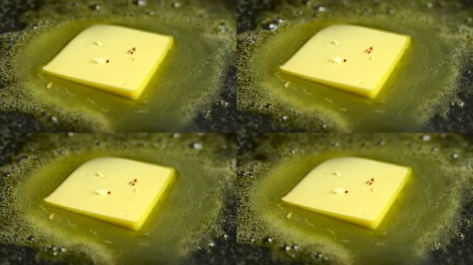 黄油块在平底锅里融化4K