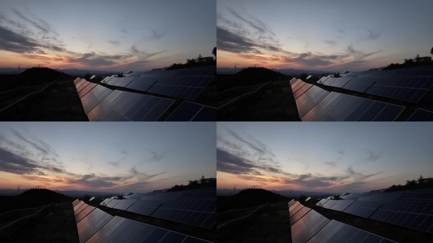航拍夕阳下山顶的光伏太阳能发电板
