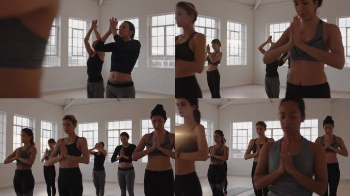 瑜伽班的一群多种族妇女练习祈祷姿势冥想享受健康的生活方式在健身工作室锻炼在日出