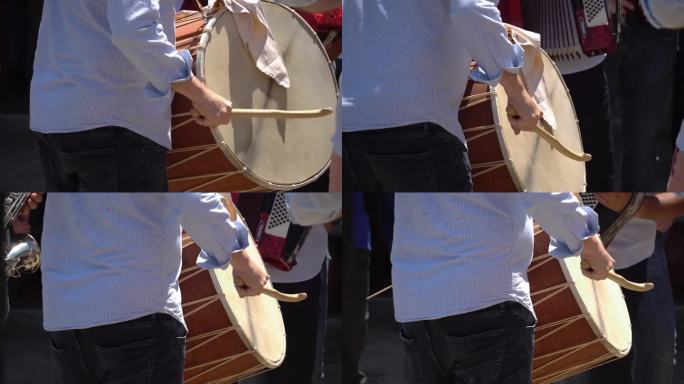 一名男子在马其顿婚礼上击鼓，在巴尔干婚礼上击鼓演奏传统歌曲
