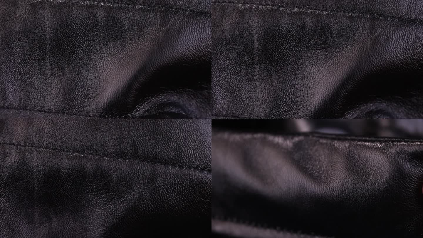 外套的细节和部分由黑色人造革制成