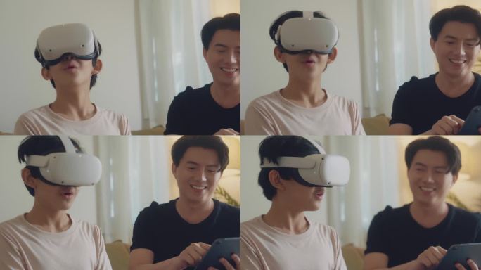 亚洲父子在家中使用虚拟现实耳机一起学习。
