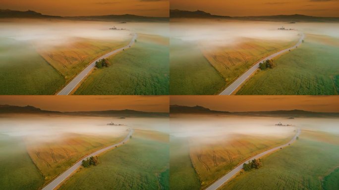 无人机视角下的雾气笼罩着田园诗般的乡村风景