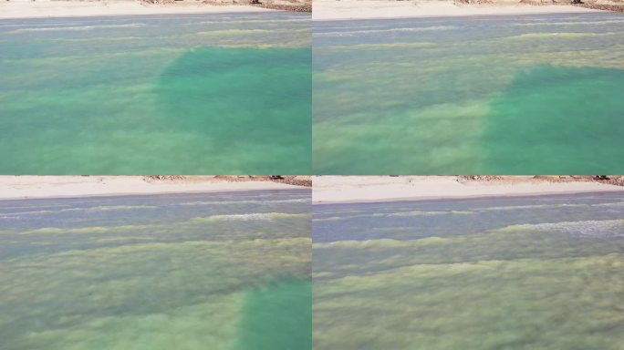 白色的沙滩，绿色的海水，海浪拍打着沙滩，大西洋