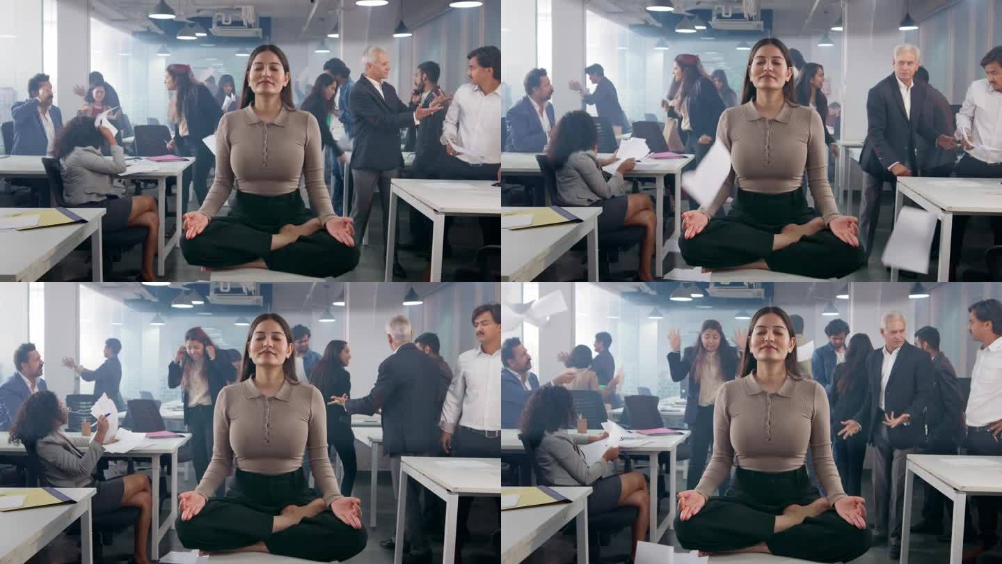 年轻的印度公司女性在繁忙混乱的办公室中摆出沉思的姿势