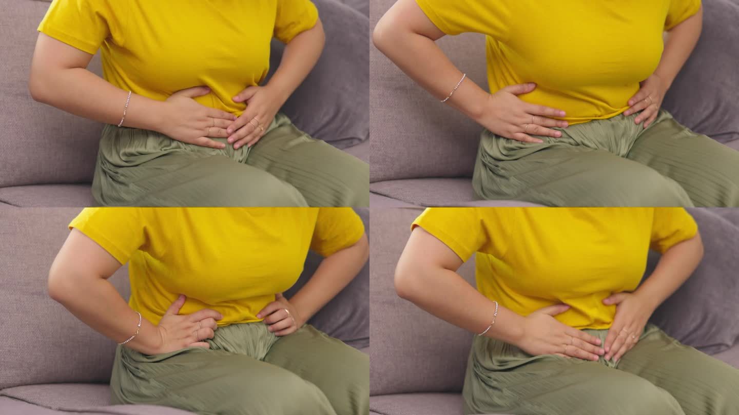 胃痛，手和女人在沙发上有经前症候群，痉挛或放屁，月经或腹胀在她的家里。腹痛和女性伴有子宫内膜异位症、