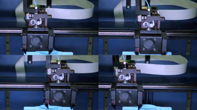 3d打印机中移动机器的特写。媒体。用机器在3D打印机上创建对象。3d打印机在打印过程中的操作过程