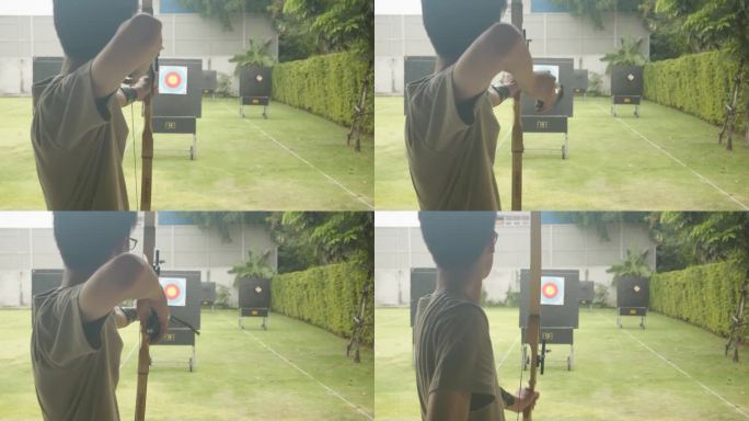 迷人的亚洲男子在靶场练习射箭。射箭。