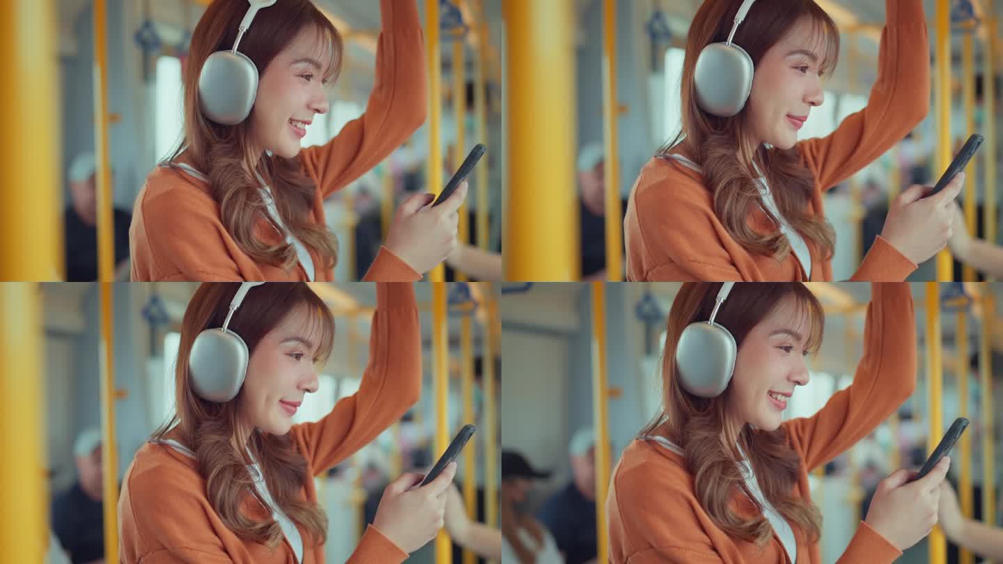 开心的年轻亚洲女乘客在火车上用智能手机听音乐，微笑的女乘客在有轨电车上戴着无线耳机，生活方式，交通。