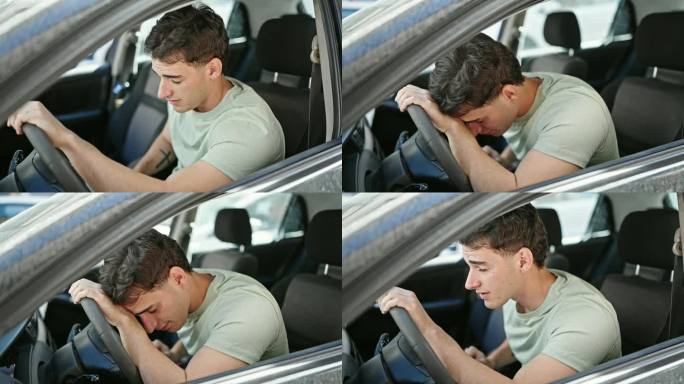 年轻的西班牙裔男子开车在街上紧张