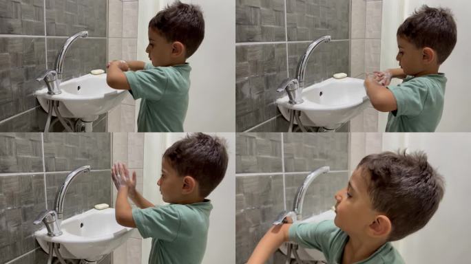 小男孩在水池里用肥皂洗手。