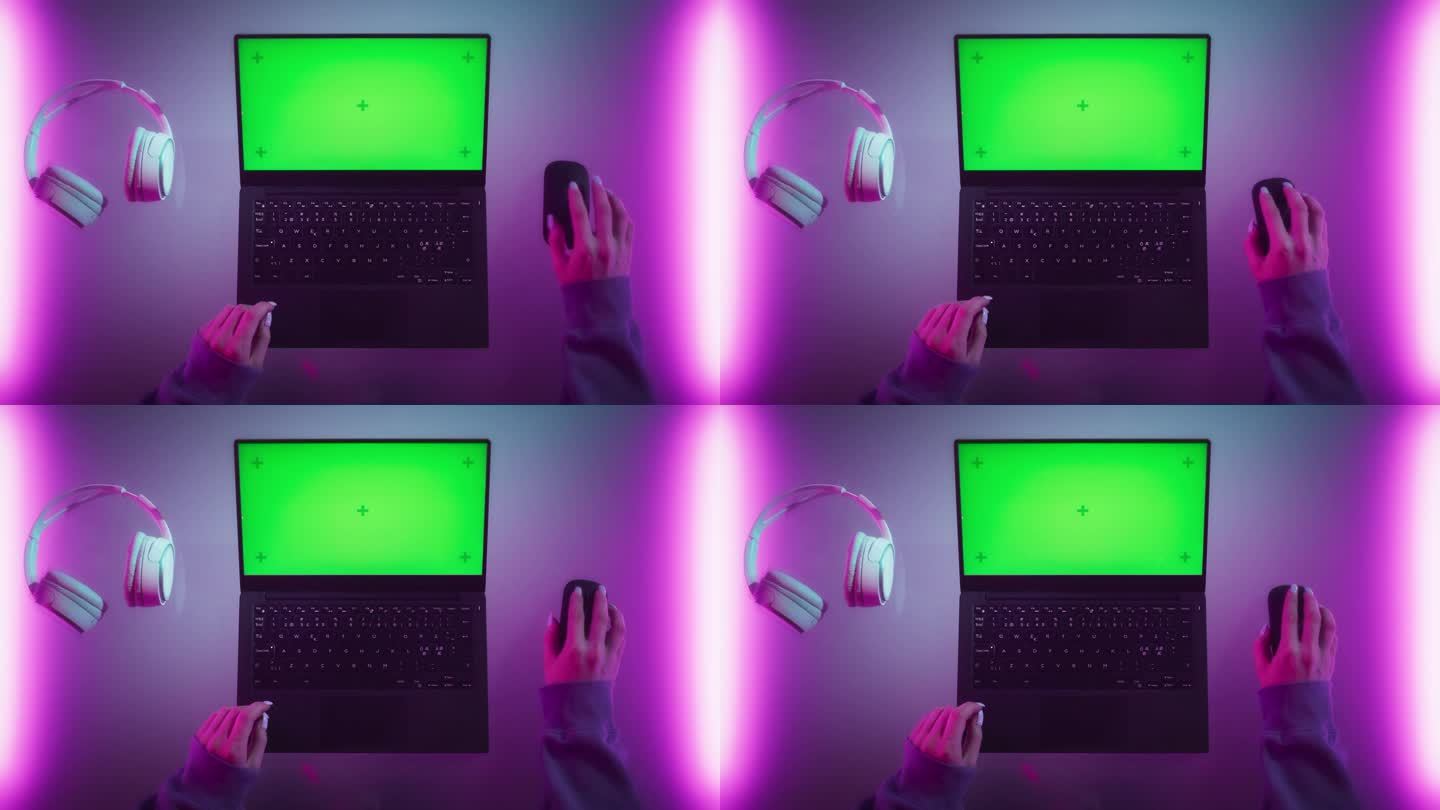 一个女性软件开发人员在一个有霓虹灯的时髦房间里用笔记本电脑工作的自上而下的照片。电脑与绿色屏幕色度键