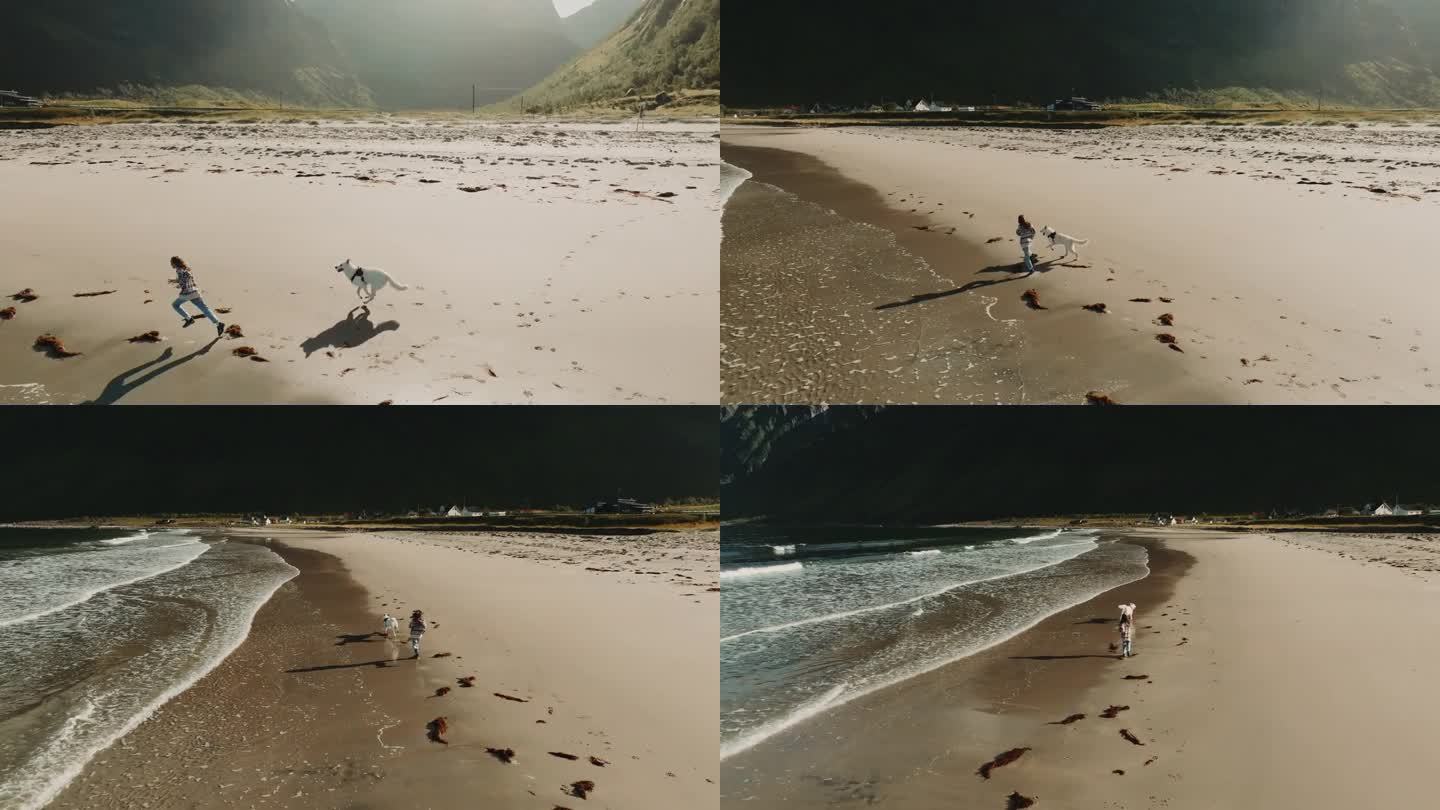 无忧无虑的概念。小女孩和白狗在厄斯峡湾沙滩上奔跑的360度全景