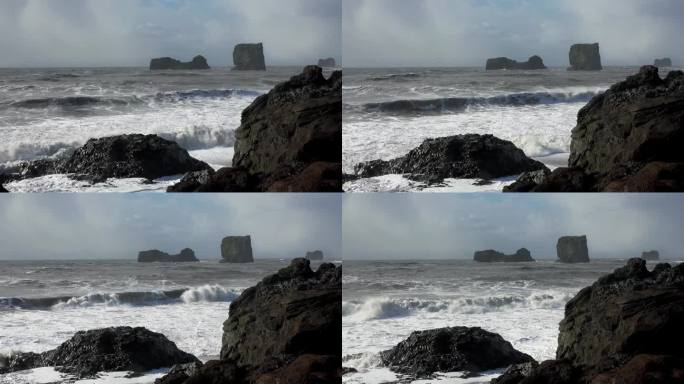 大西洋上的大悬崖。冰岛。大西洋的海浪。狂野的大西洋海岸。黑色火山海岸悬崖。石礁和海水