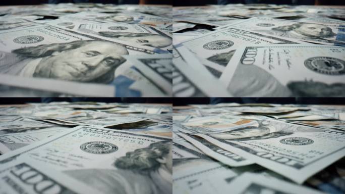 美元钞票散落桌上近距离。成堆的美国钞票
