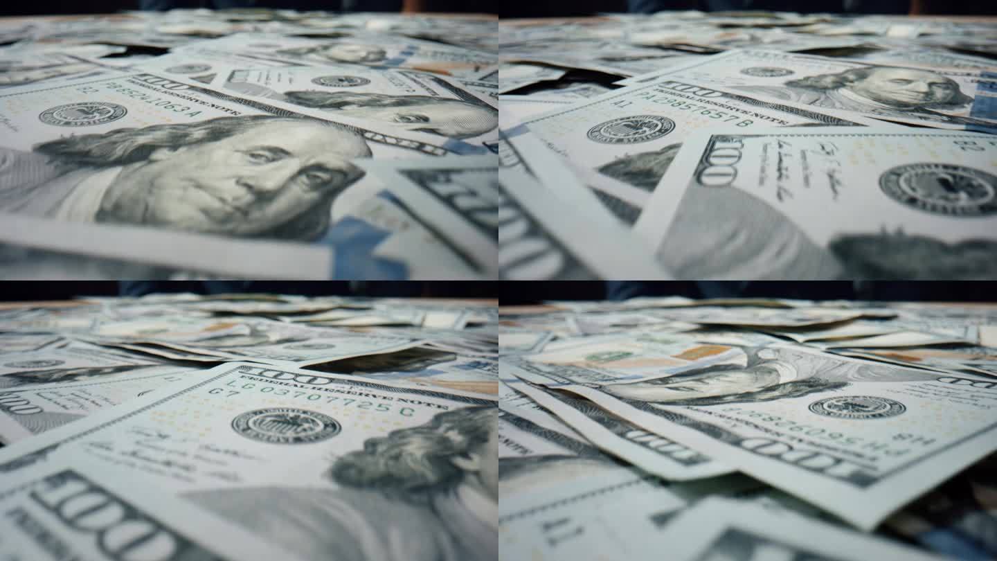 美元钞票散落桌上近距离。成堆的美国钞票