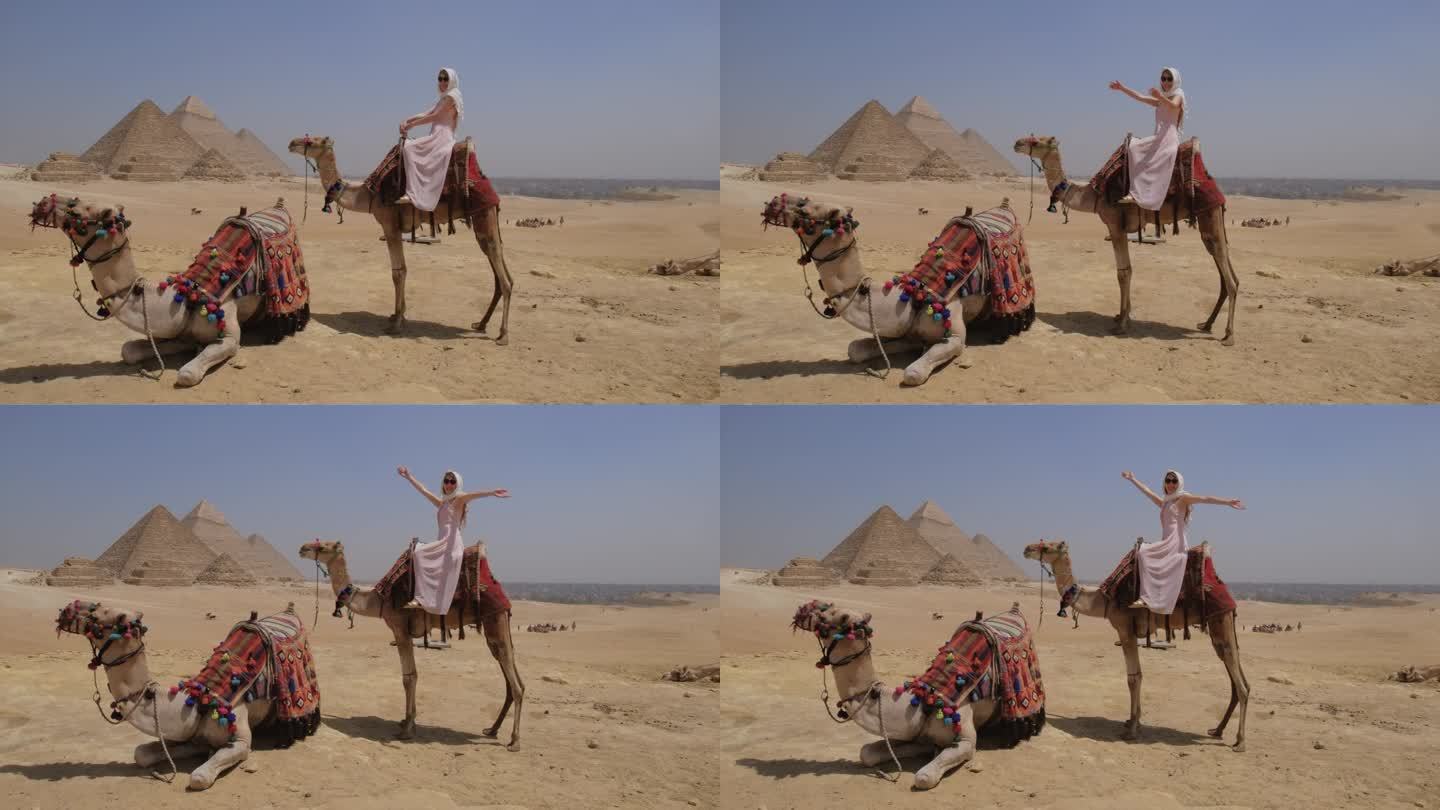 一名年轻女子在埃及骑骆驼。