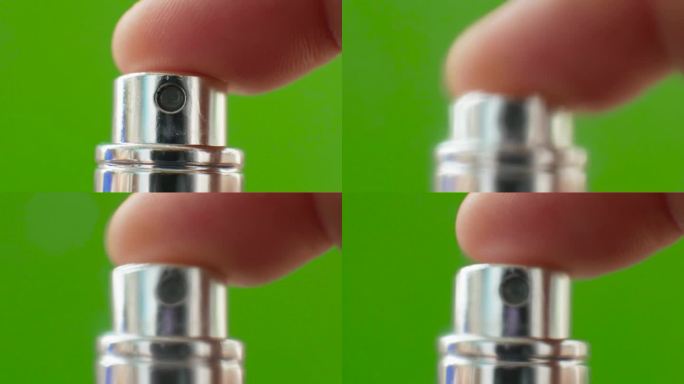 绿色背景上的香味扩散喷雾器，用花露水喷雾器。色度键，香水喷射器喷雾到相机屏幕，雾化器。