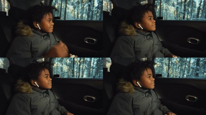 非裔美国小孩开车时戴耳机