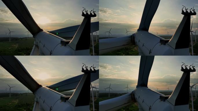 日落时风力涡轮机的航拍照片。