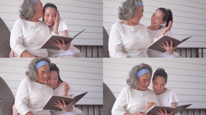 亚洲老年妇女和女儿在家里看书