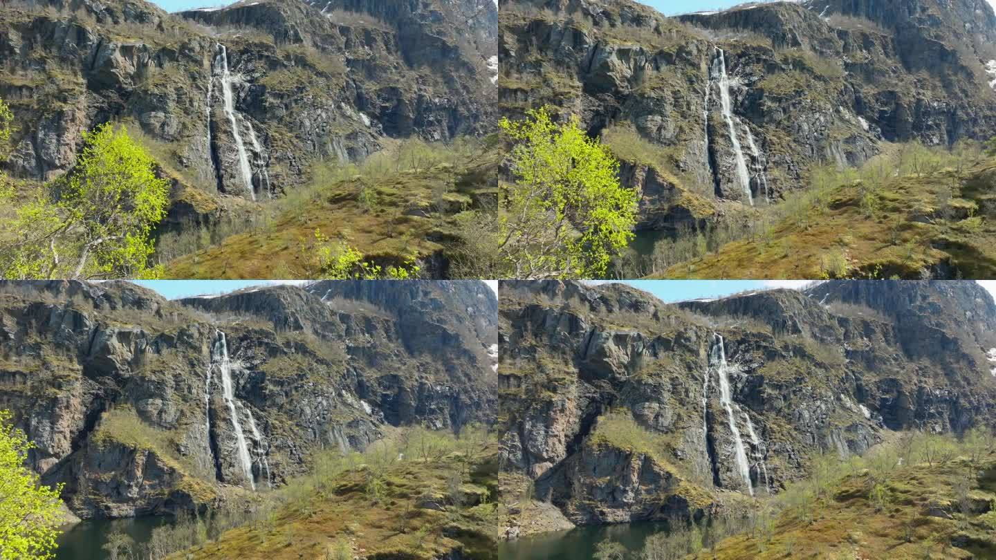 春天奥兰峡谷风景优美的原始瀑布;无人机透露