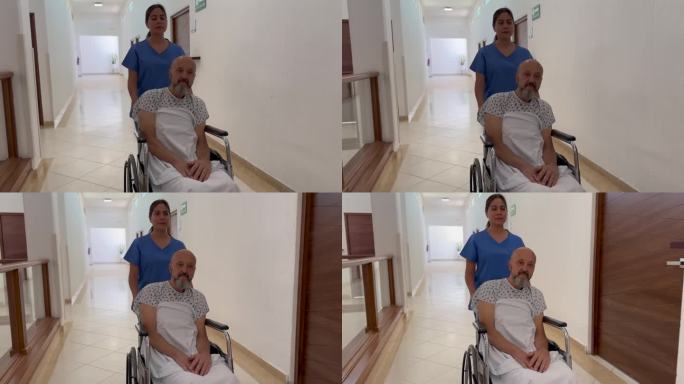 护士用轮椅抬着病人穿过医院。
