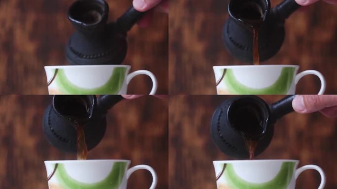 杯子里的咖啡和木制背景上的陶土瓷杯。