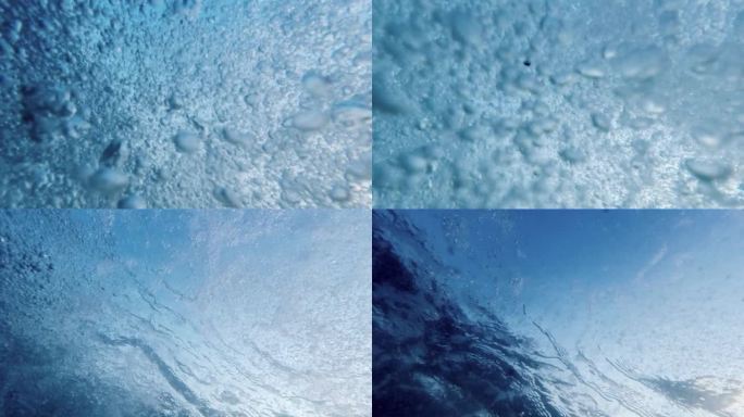 气泡从海底上升到水面的慢动作，由潜水员的呼气增强。一个理想的选择，创造一个抽象和宁静的自然背景。